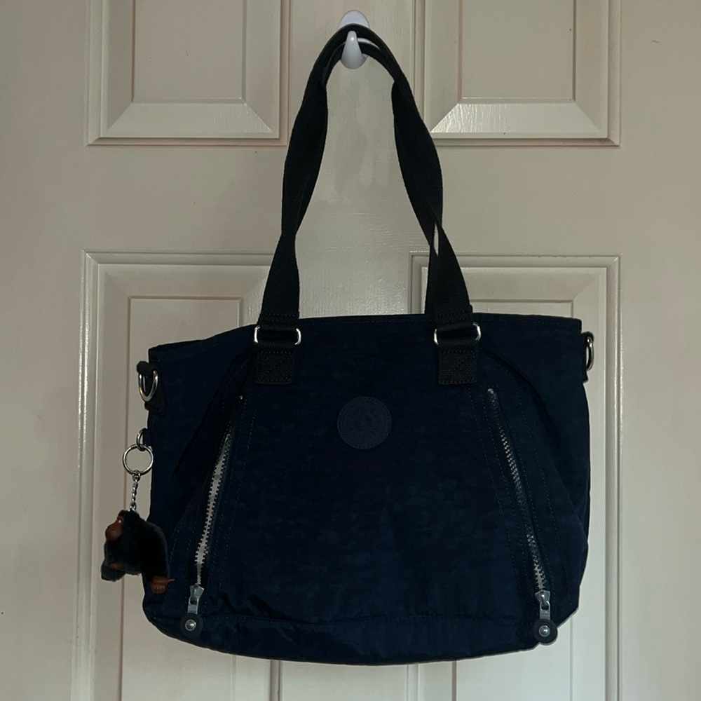 NOT FOR SALE.   
Kipling black bag with keychain , and extra strap.